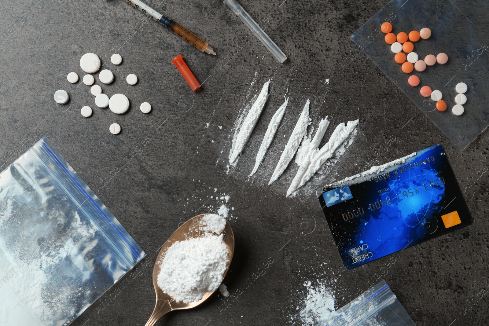 Photo of Flat lay composition with different drugs on gray textured table