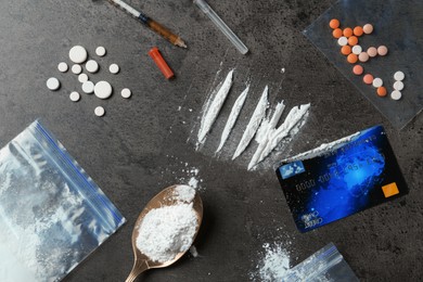 Photo of Flat lay composition with different drugs on gray textured table