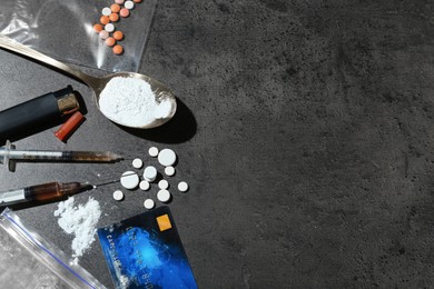 Photo of Flat lay composition with different drugs on gray textured table, space for text