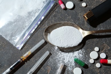 Photo of Flat lay composition with different drugs on gray textured table