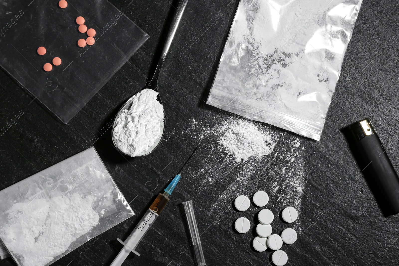 Photo of Flat lay composition with different drugs on black textured table