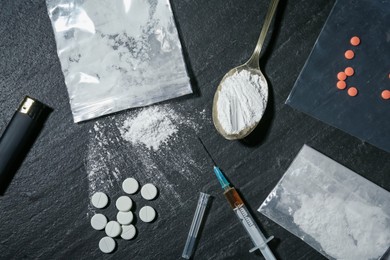 Photo of Flat lay composition with different drugs on black textured table