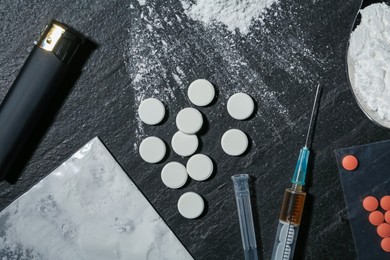 Photo of Flat lay composition with different drugs on black textured table