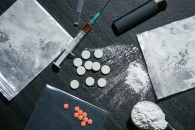 Photo of Flat lay composition with different drugs on black textured table