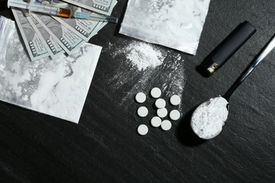 Photo of Flat lay composition with different drugs on black textured table