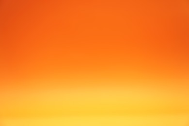 Photo of Orange gradient background. Abstract color backdrop for design