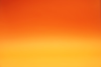 Photo of Orange gradient background. Abstract color backdrop for design