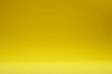 Photo of Yellow gradient background. Abstract color backdrop for design