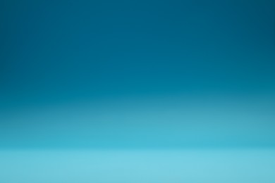 Photo of Light blue gradient background. Abstract color backdrop for design