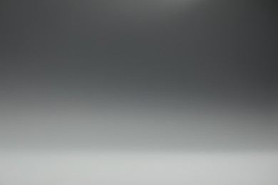 Photo of Grey gradient background. Abstract color backdrop for design