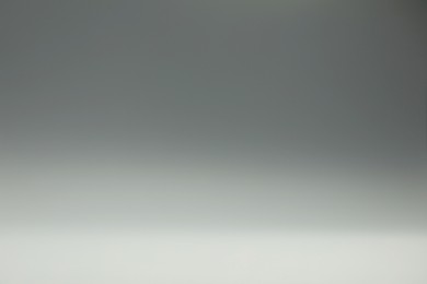 Photo of Grey gradient background. Abstract color backdrop for design