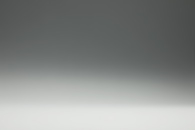 Photo of Grey gradient background. Abstract color backdrop for design