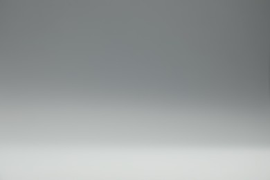 Photo of Grey gradient background. Abstract color backdrop for design