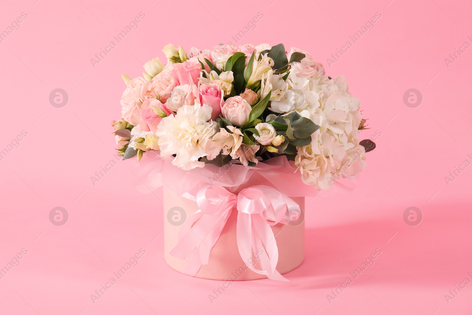 Photo of Bouquet of beautiful flowers on pink background