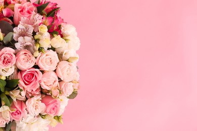 Photo of Bouquet of beautiful flowers on pink background, top view. Space for text