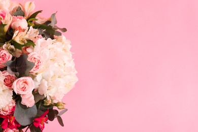 Photo of Bouquet of beautiful flowers on pink background, top view. Space for text