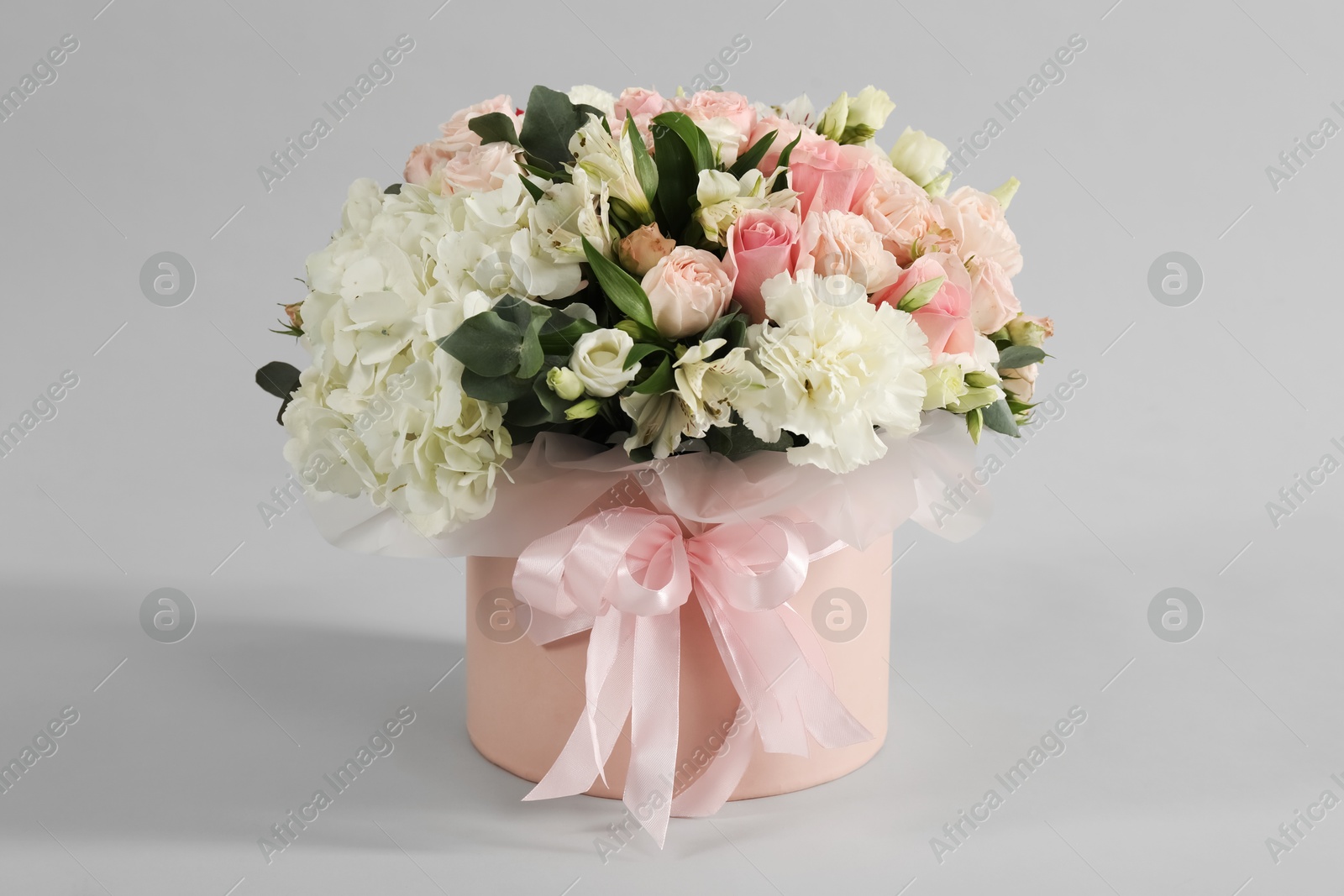 Photo of Bouquet of beautiful flowers on grey background