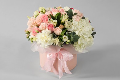 Photo of Bouquet of beautiful flowers on grey background