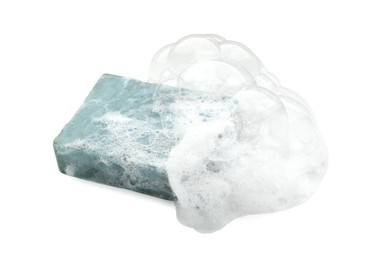 Photo of Bar soap with foam on white background