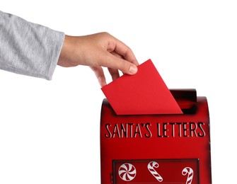 Photo of Man putting letter to Santa Claus into red mail box against white background, closeup. Christmas tradition