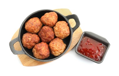 Photo of Tasty meatballs in baking dish and tomato sauce isolated on white, top view