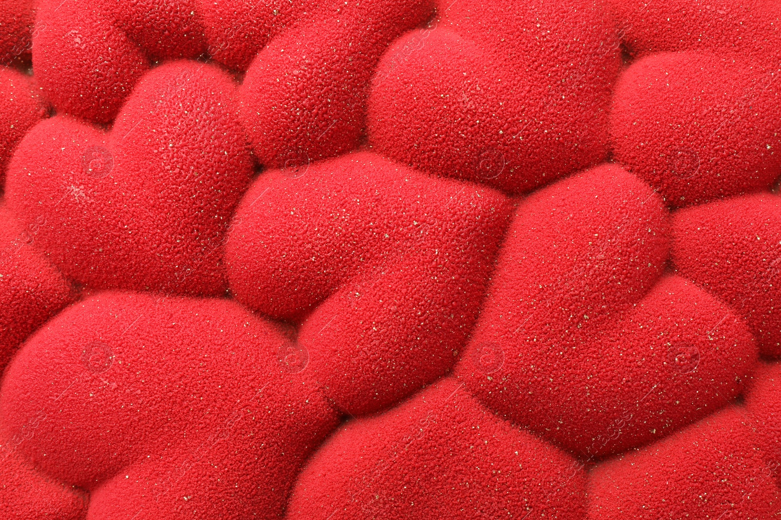 Photo of Chocolate bar decorated with hearts as background, top view