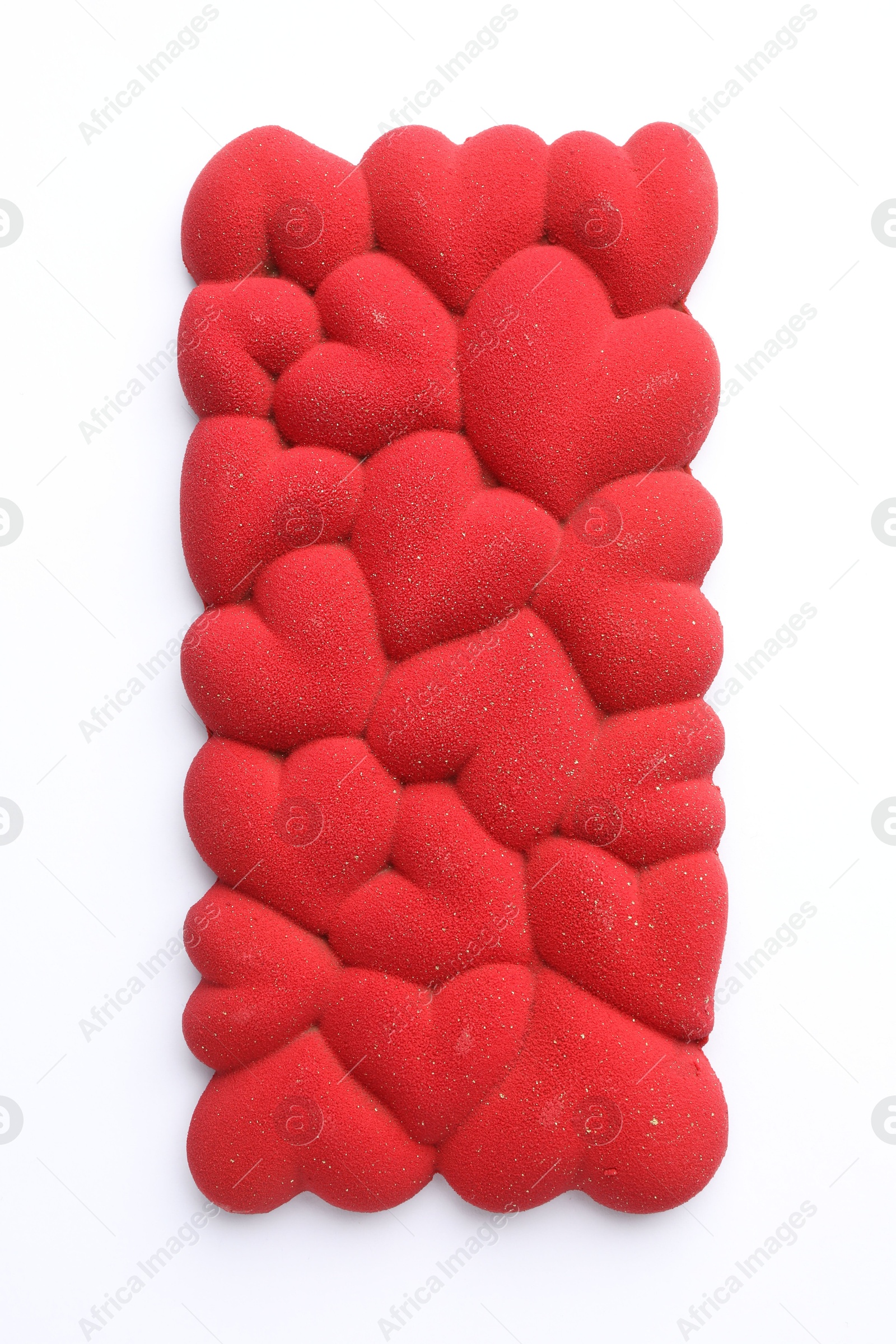 Photo of Chocolate bar decorated with hearts isolated on white, top view