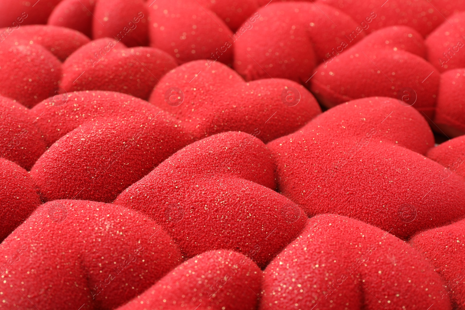 Photo of Chocolate bar decorated with hearts as background, closeup