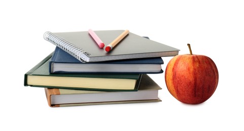 Photo of Stack of notebooks, pen, pencil and apple on white background