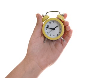 Photo of Woman with alarm clock on white background, closeup