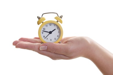 Photo of Woman with alarm clock on white background, closeup