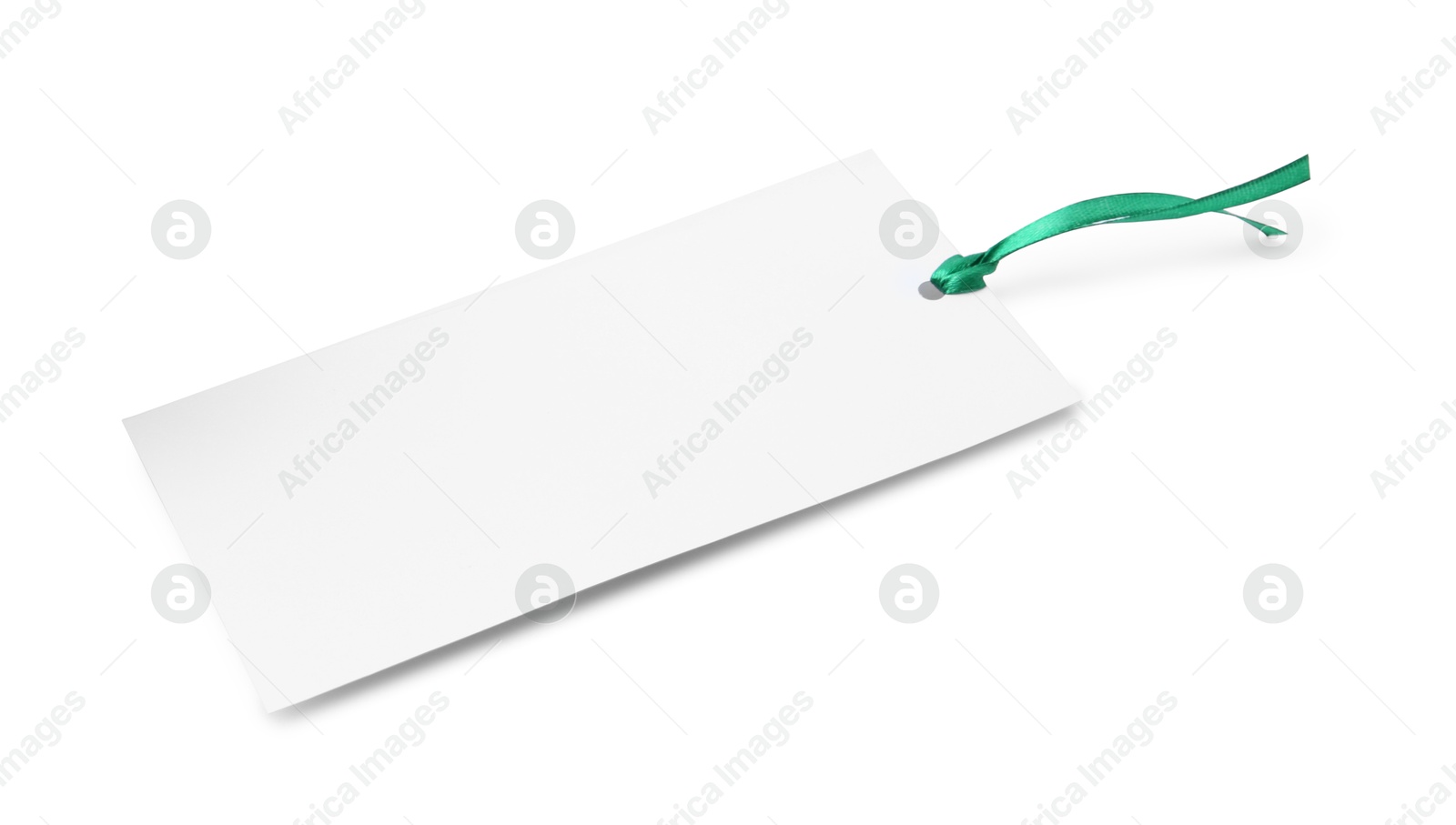 Photo of Paper bookmark with ribbon isolated on white