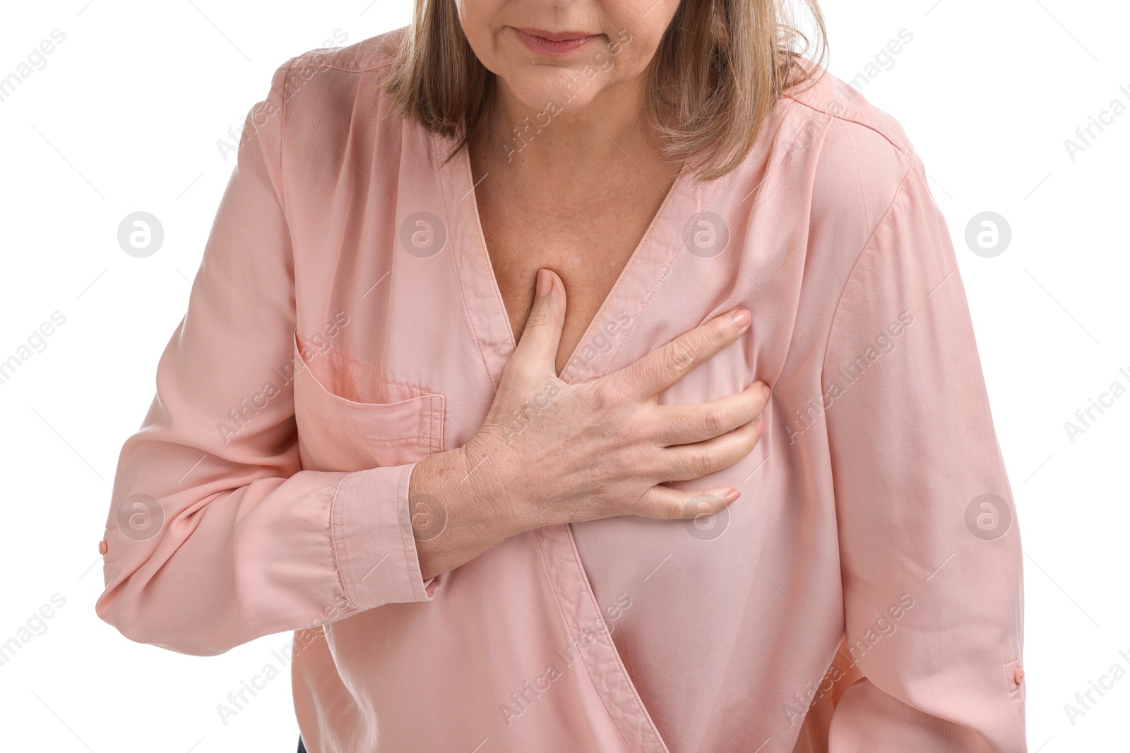 Photo of Heart attack. Senior woman suffering from pain in chest on white background, closeup