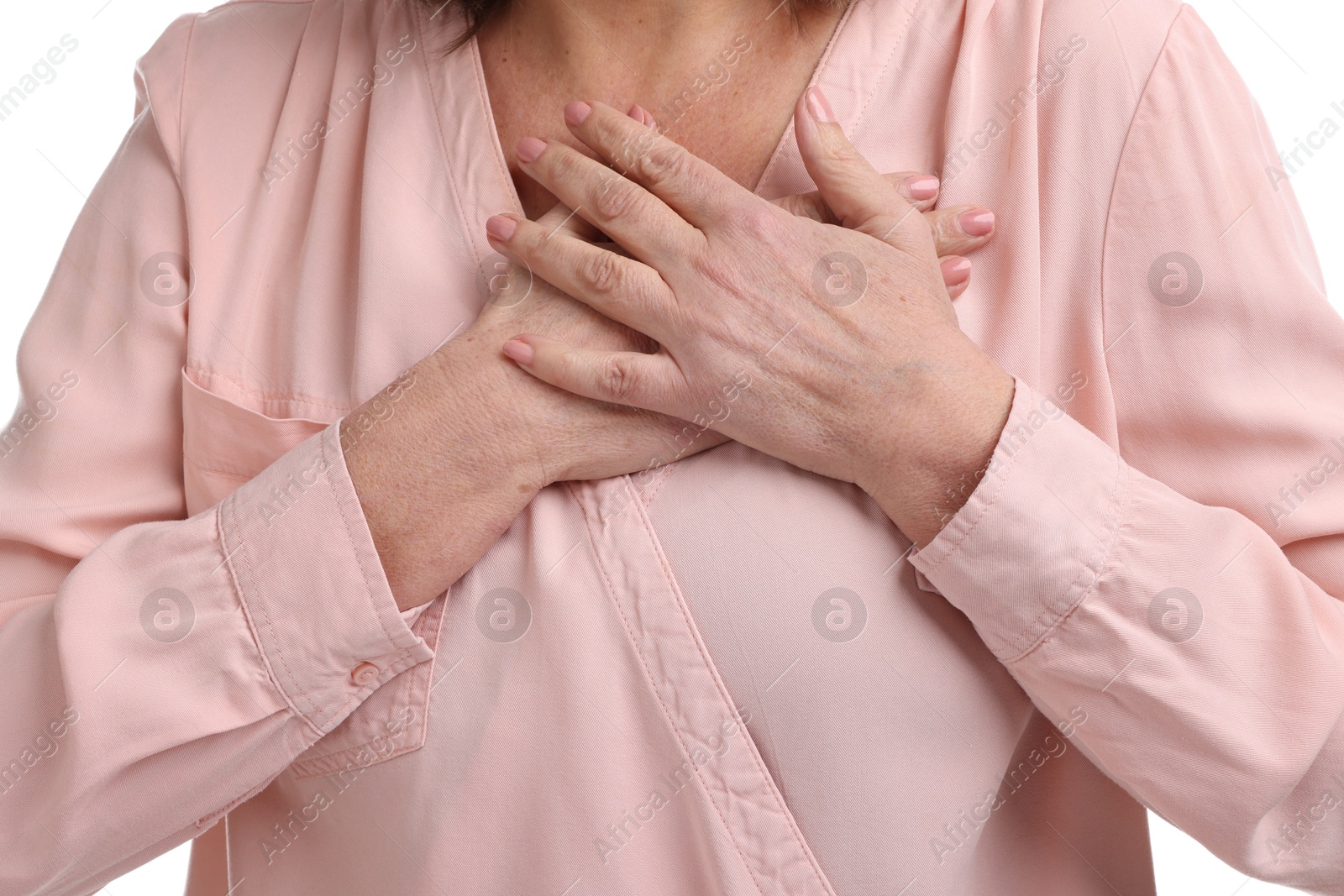 Photo of Heart attack. Senior woman suffering from pain in chest on white background, closeup