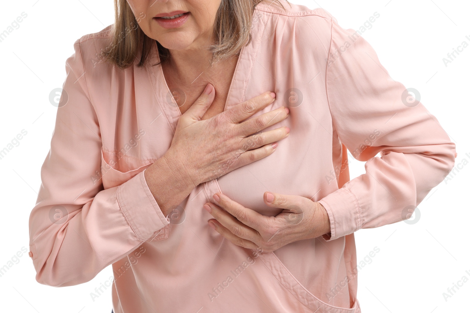 Photo of Heart attack. Senior woman suffering from pain in chest on white background, closeup