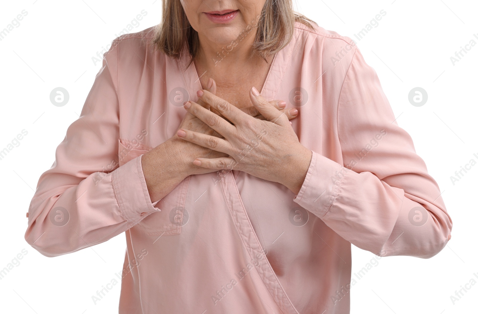 Photo of Heart attack. Senior woman suffering from pain in chest on white background, closeup