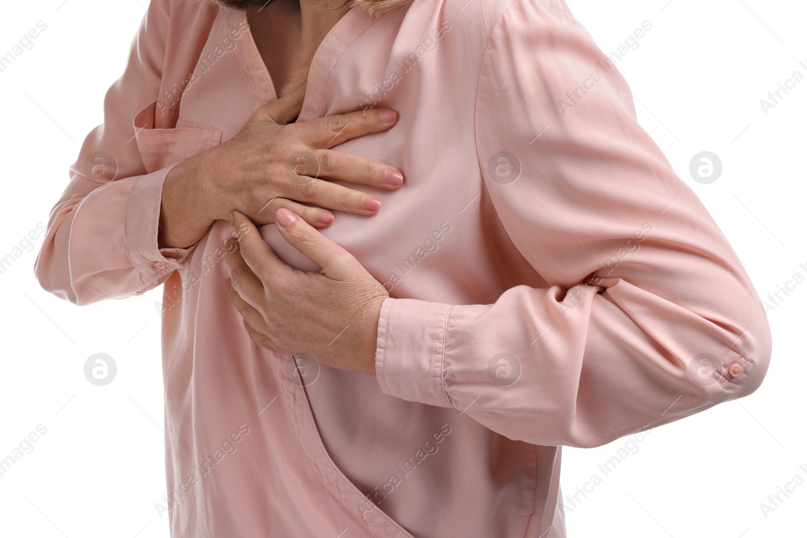 Photo of Heart attack. Senior woman suffering from pain in chest on white background, closeup