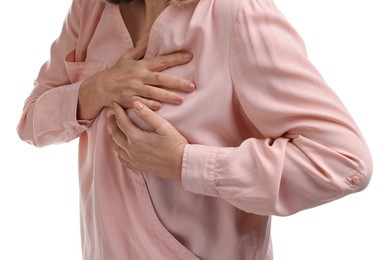 Photo of Heart attack. Senior woman suffering from pain in chest on white background, closeup