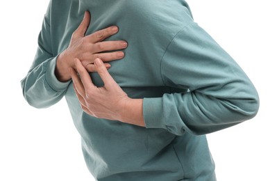 Photo of Heart attack. Senior woman suffering from pain in chest on white background, closeup