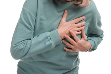 Photo of Heart attack. Senior woman suffering from pain in chest on white background, closeup