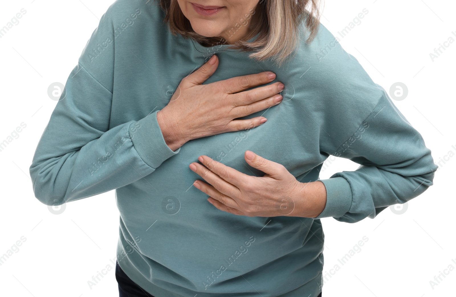 Photo of Heart attack. Senior woman suffering from pain in chest on white background, closeup