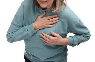 Photo of Heart attack. Senior woman suffering from pain in chest on white background, closeup