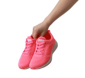 Photo of Woman with neon pink sneakers on white background, closeup