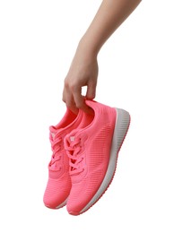 Photo of Woman with neon pink sneakers on white background, closeup