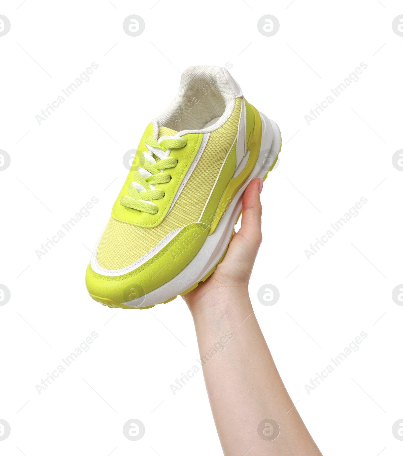 Photo of Woman with neon lime sneaker on white background, closeup