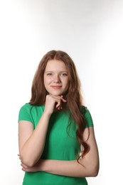 Photo of Beautiful teenage girl with freckles on white background