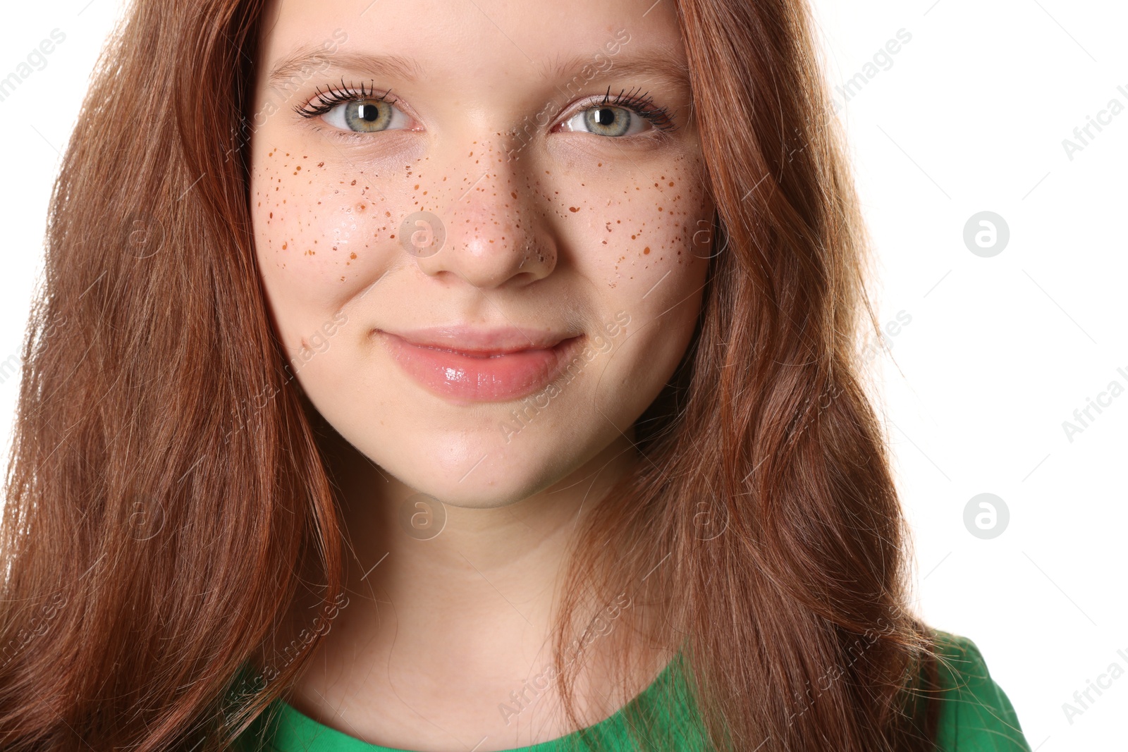 Photo of Beautiful teenage girl with freckles on white background, closeup