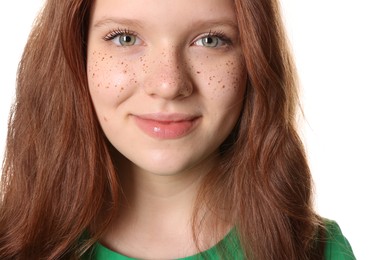 Photo of Beautiful teenage girl with freckles on white background, closeup