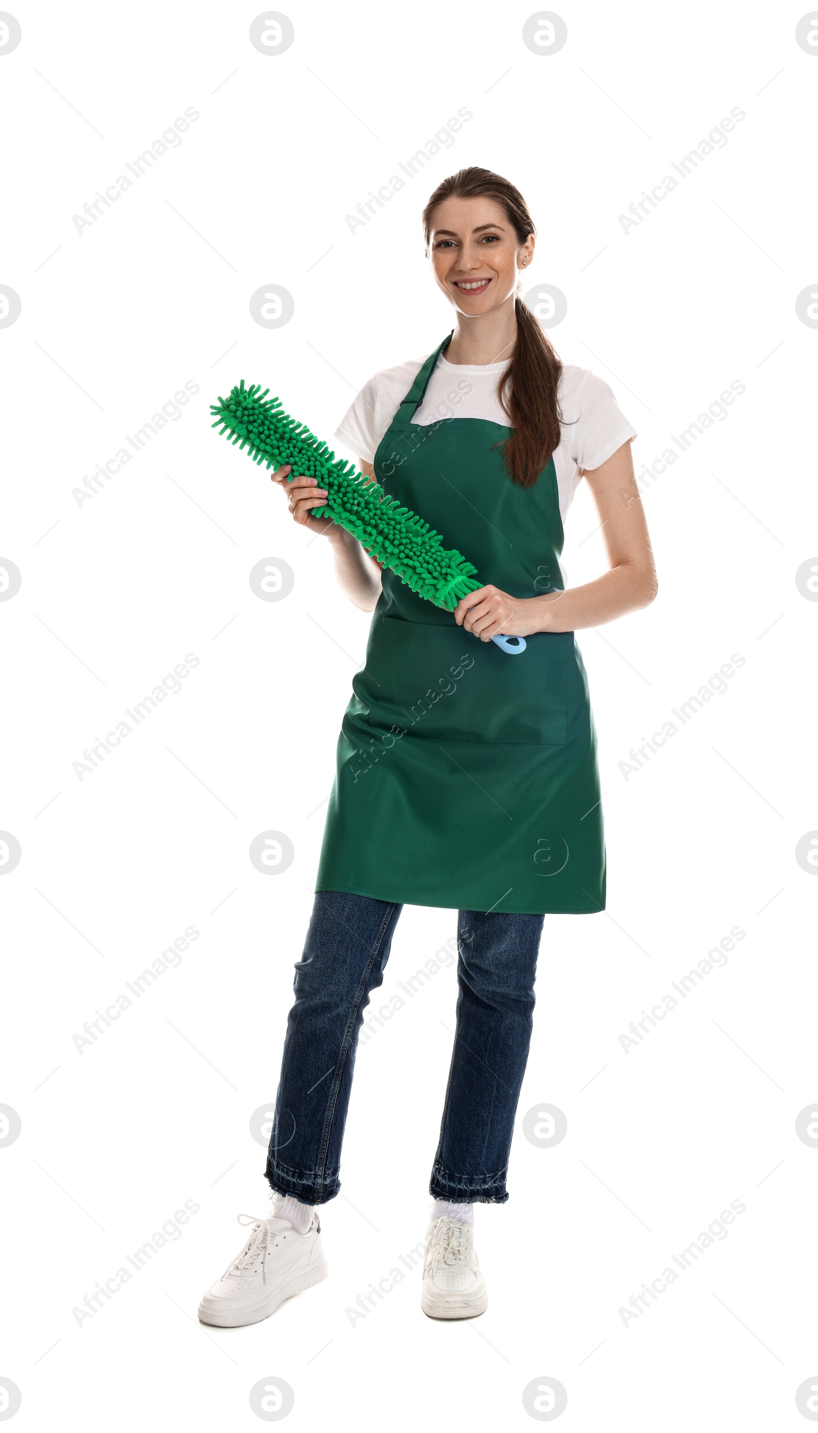 Photo of Smiling cleaning service worker with dusting brush on white background