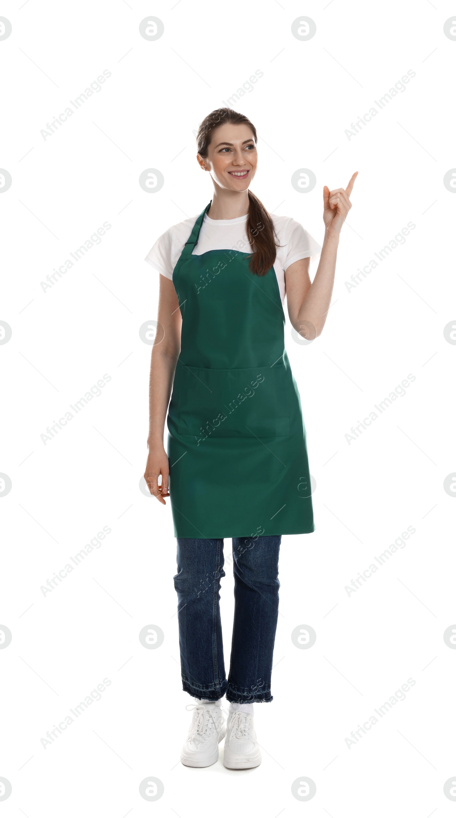 Photo of Smiling cleaning service worker pointing at something on white background